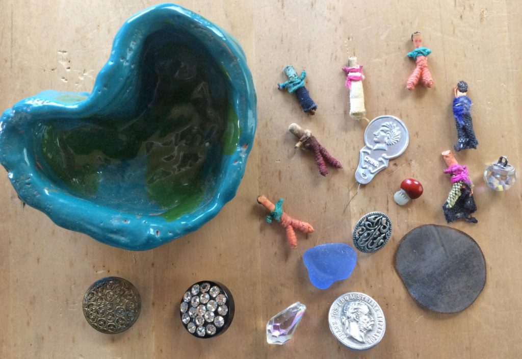 trinkets as treasure, coin button, worry dolls, sparkly button, crystal, seaglass